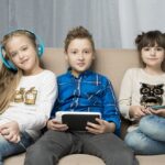 technology-concept-with-happy-kids-couch